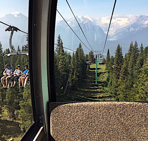 Ski chairs & gondolas near Lake Louise (which is the small circle midway down the right cable).