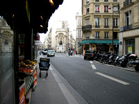 Our hotel was down the street on the left -- that's a statue of Moliere in the middle and the cart belongs to the mailman